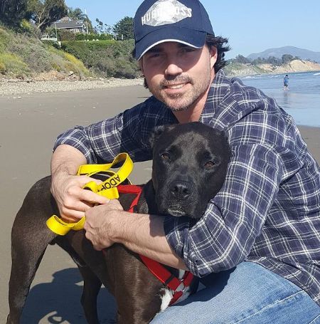 Aaron Phypers roaming around with his pet.